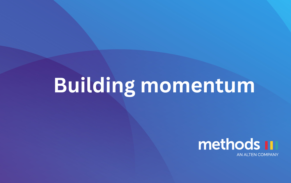 Coloured background with text reading Building Momentum