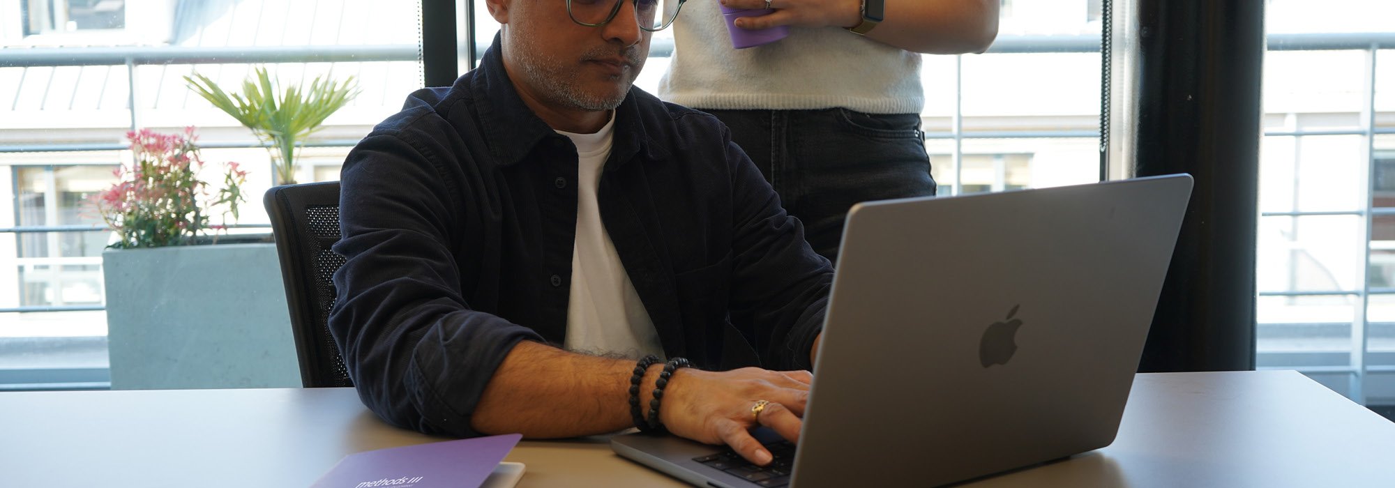 Decorative photo of Methods employees in Methods office