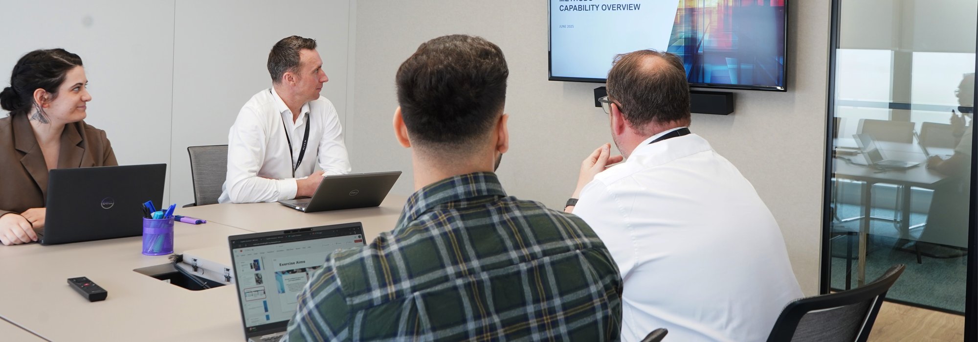 Decorative photo of Methods employees in Methods office