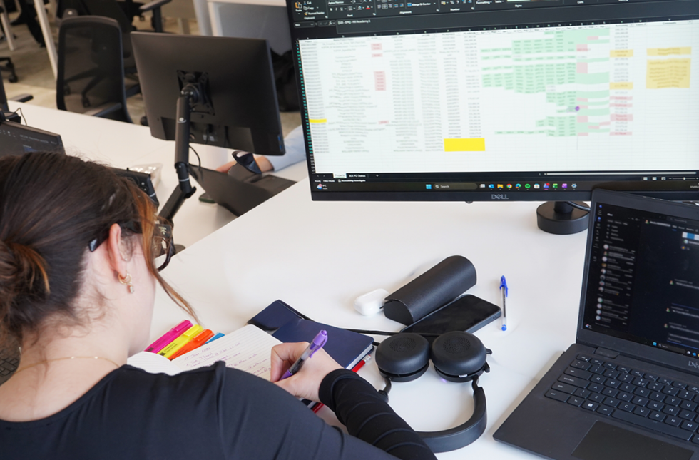 Decorative photo of Methods employees in Methods office Decorative photo of Methods employees in Methods office