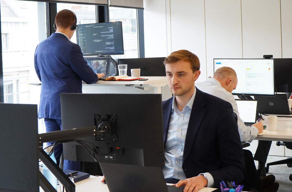 Decorative photo of Methods employees in Methods office