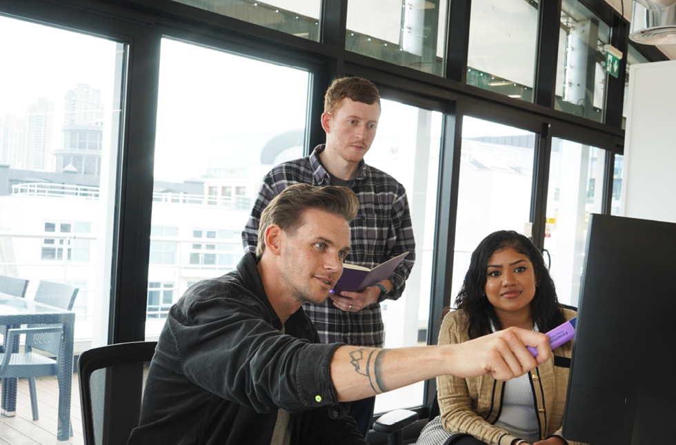 Decorative photo of Methods employees in Methods office